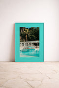 Turquoise, luxury framed fine art print by Noëlle Nijhuis (NOË NÍ), featuring a sunlit pool scene with tropical palms, a refreshing statement for high end interiors